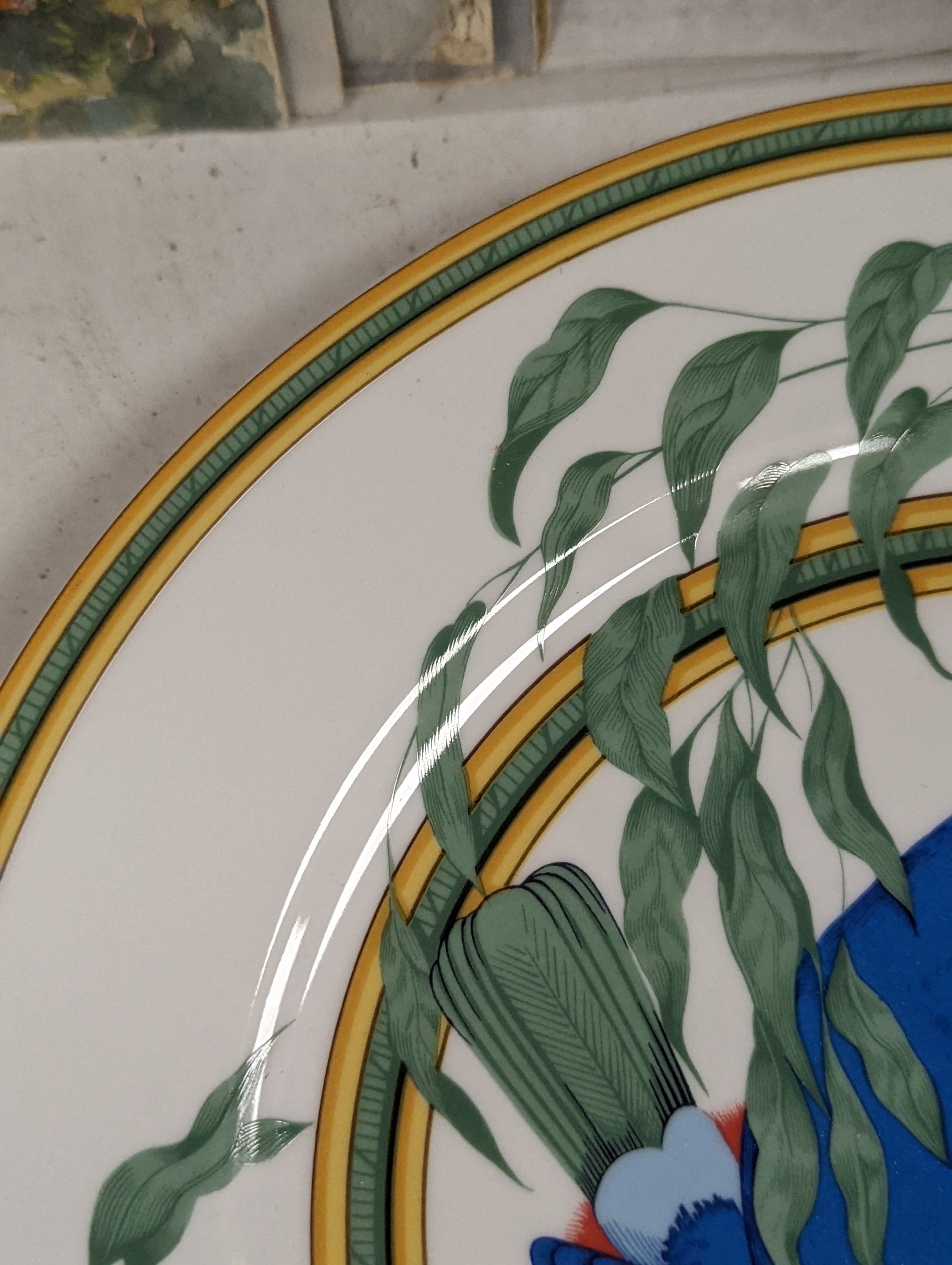 A pair of Hermes, Paris 'Toucan' plates, diameter 27.5cm, edge blemishes